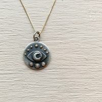 Arlo Eye medallion